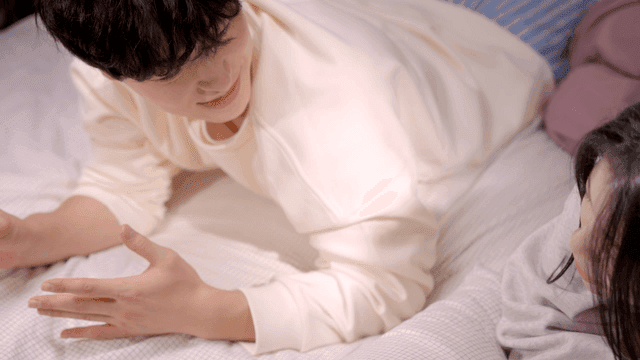 Couple talking together on bed