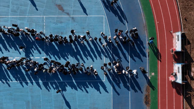 People gathering on a sports court