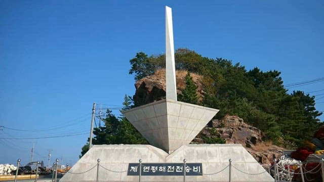 Stone Monument with Engraved Text under the Sky
