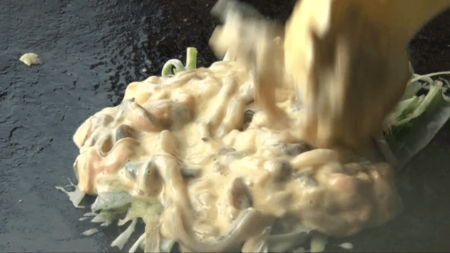 Cooking Korean pancake on a hot griddle