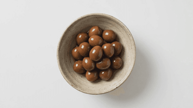 Bowl containing braised quail eggs