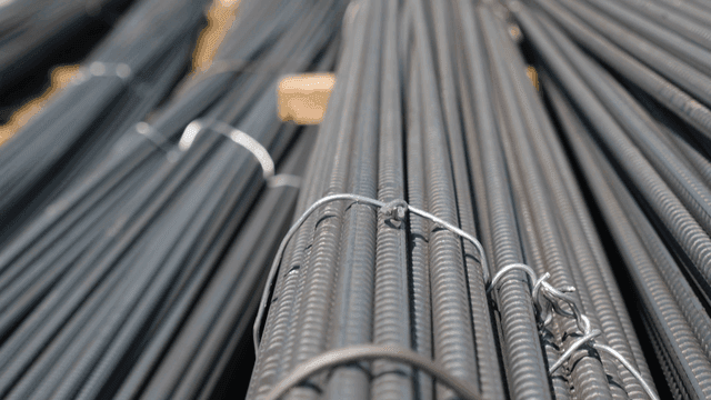 Stacks of steel rebar on a construction site