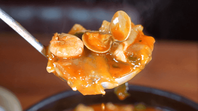 Ladleful of spicy seafood dumplings