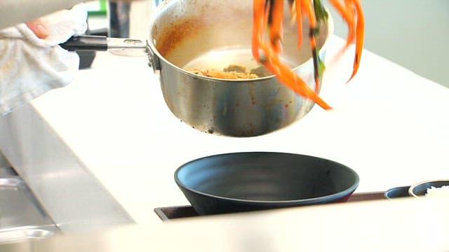 Plating ramen with red snow crab cooked in a pot in the kitchen