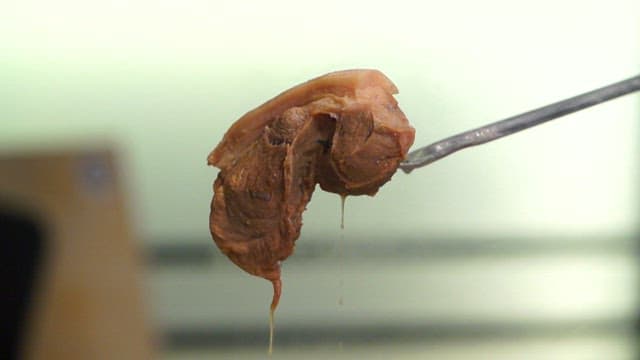 Piece of boiled pork dripping juice