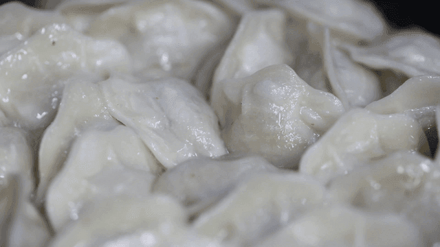 Steamed dumplings glistening with moisture