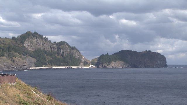 Serene Coastal Landscape with Rocky Cliffs