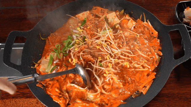 Simmering budaejjigae in pot