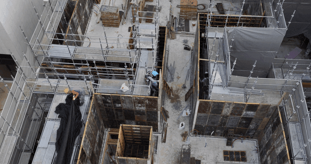 Construction site with scaffolding and workers