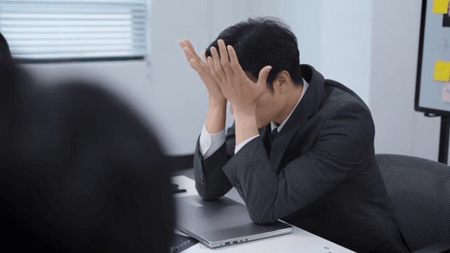 Office meeting with a stressed employee