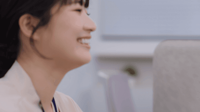 A woman working with a smile in the office