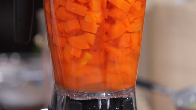 Carrots blending in a kitchen blender