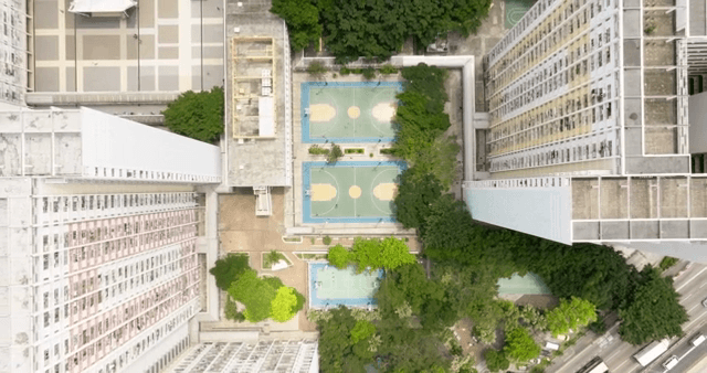 Basketball courts surrounded by tall buildings