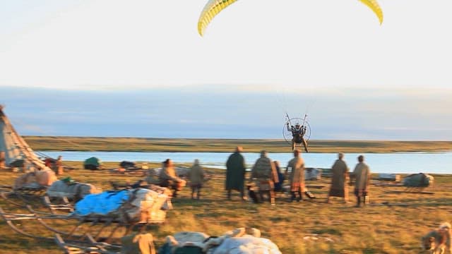 Powered paragliding over a traditional nomadic camp