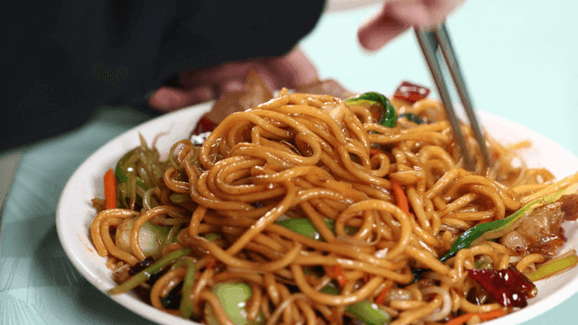 Chopsticks for mixing stir-fried noodles with vegetables