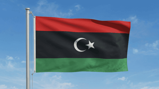 Libyan flag fluttering against clear sky
