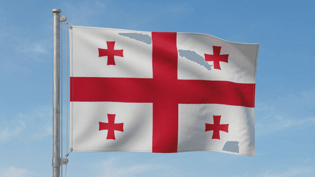 Georgian flag fluttering under clear sky