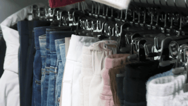Various clothes hanging on a rack
