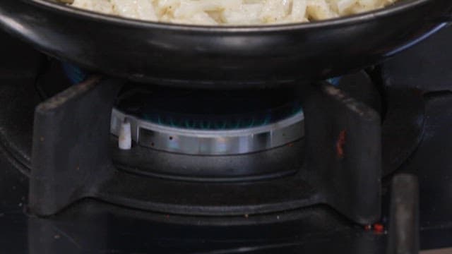 Potato Pancake Being Griddled in an Oiled Frying Pan