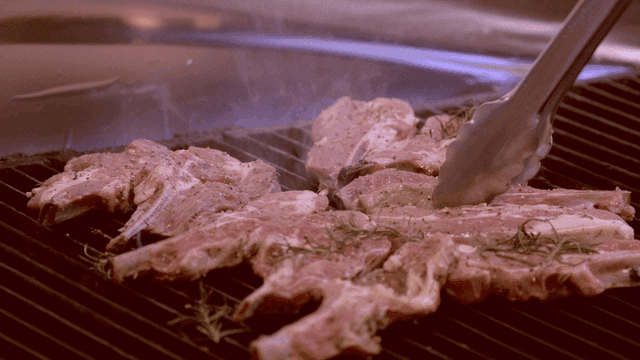 Lamb chops grilling with rosemary