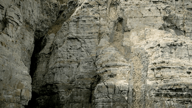 Rocky cliff face with textured layers