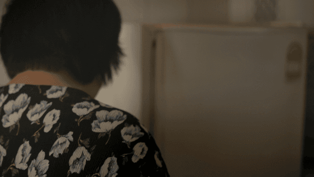 Person opening a refrigerator