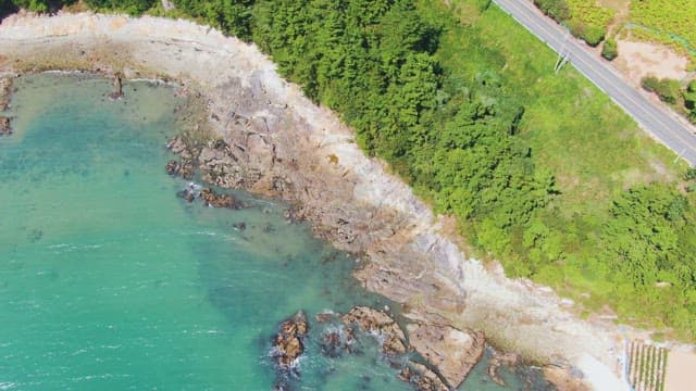 Coastal road and rocky shoreline