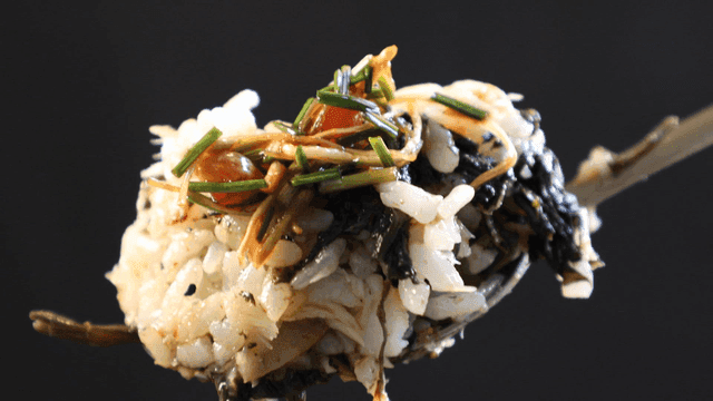 Spoonful of seasoned rice with seaweed