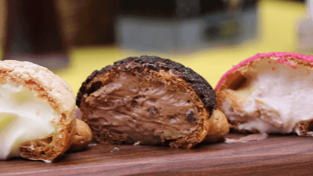 Various colored soboro breads with cream on a wooden board