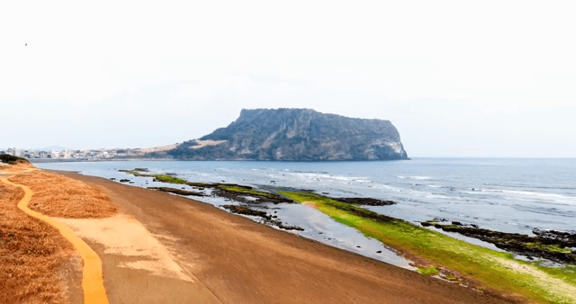 Serene beach with a distant mountain