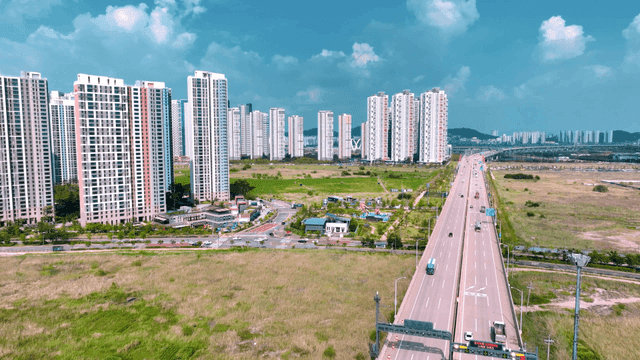 High-rise buildings and a busy highway