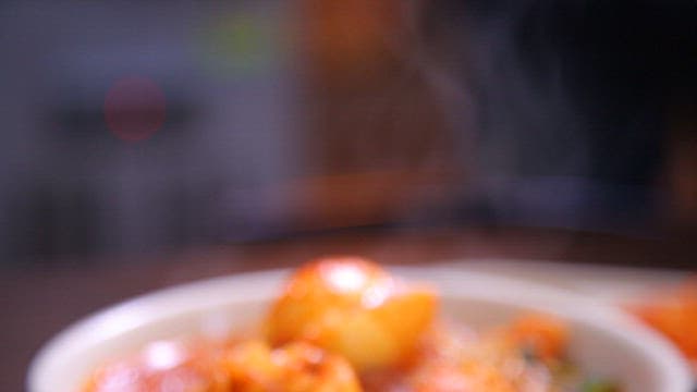 Steaming bowl of spicy tteokbokki