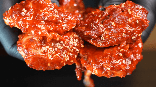 Cross-section of spicy marinated crab sprinkled with sesame seeds