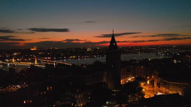 Twilight over a bustling waterfront cityscape