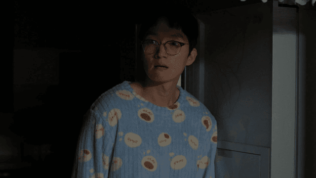 Man in pajamas raising his head