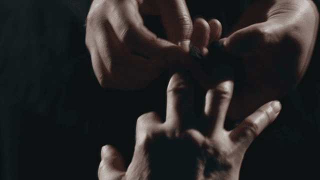 Patient wearing medical sensor on his finger