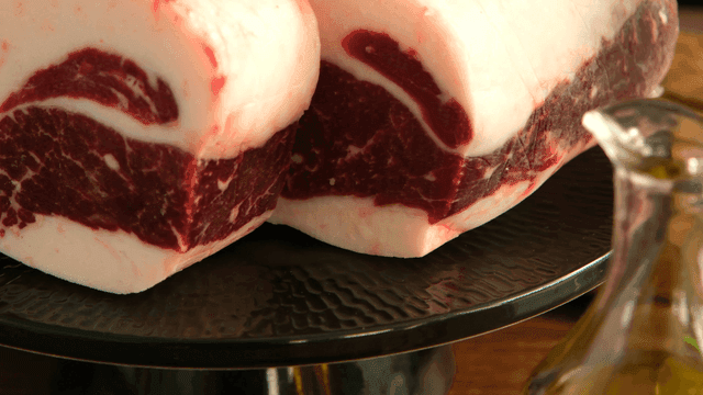 Thick cuts of marbled beef on a plate