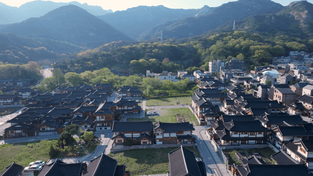 Sunny hanok village by the mountain