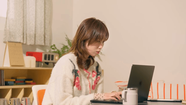 Woman working on a laptop indoors