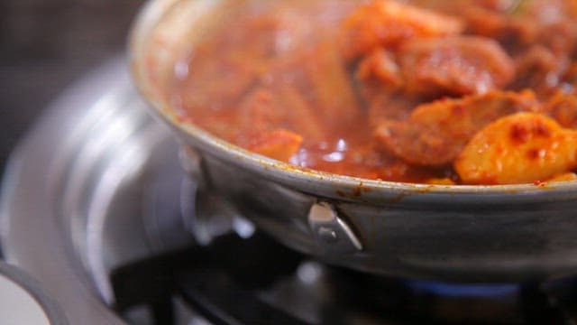 Spicy braised ribs boiling in a pot