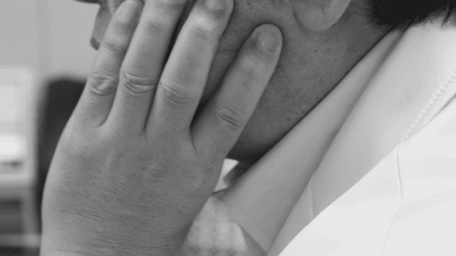 A person deep in thought indoors