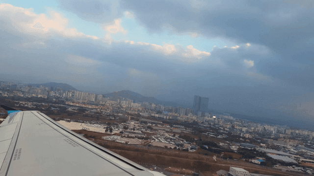 View from airplane window over cityscape