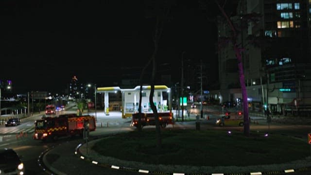 Fire Truck and Ambulance Crossing the Road at Night