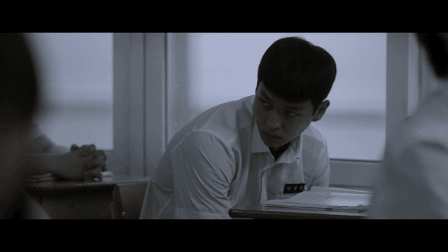 Student glaring at classmate during lesson