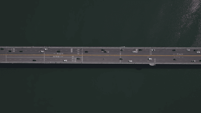 Bridge with vehicles over river