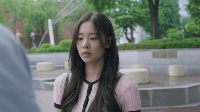 Young woman with a serious expression in the park