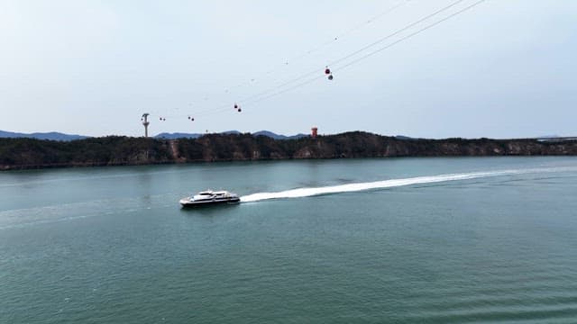 Boat cruising near a scenic coastline