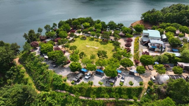 Serene Lakeside Campsite Filled with Green Trees