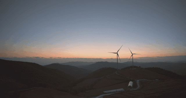 Wind turbines on the mountain at sunrise