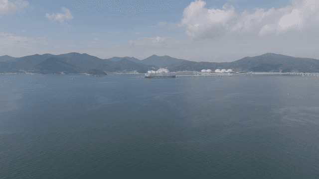 Large ships near coastal industrial areas